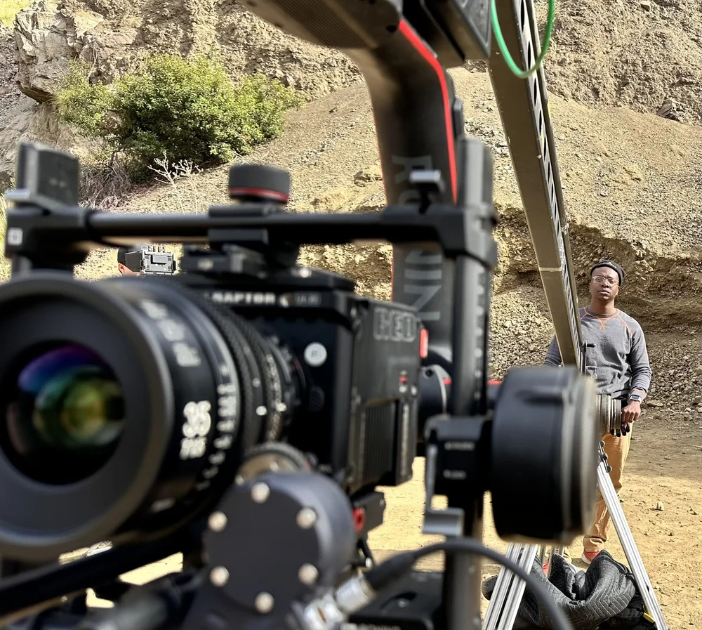 Rydrea Walker filming on a rocky outdoor location