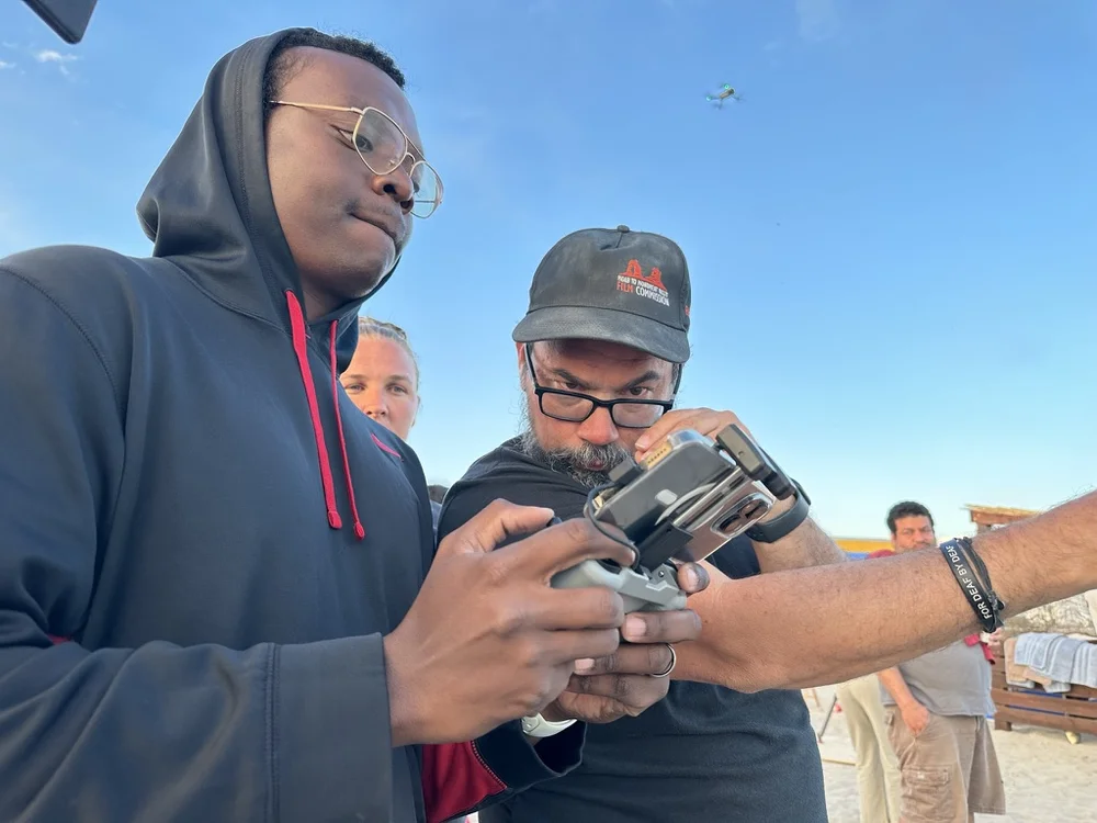 Rydrea Walker operating a drone on a beach shoot